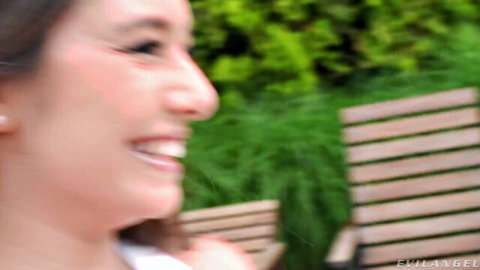 Selva Lapiedra smiling seductively in white top outdoors