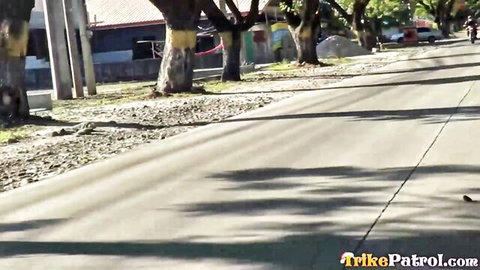 Filipino street scene with painted trees and tricycles from TrikePatrol amateur porn site