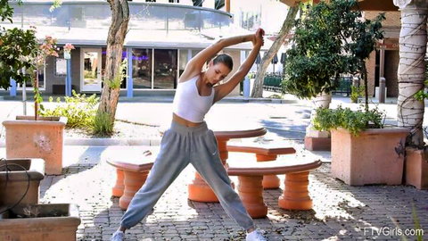 Jewel Diamant stretches in tight crop top and sweatpants during public outdoor tease