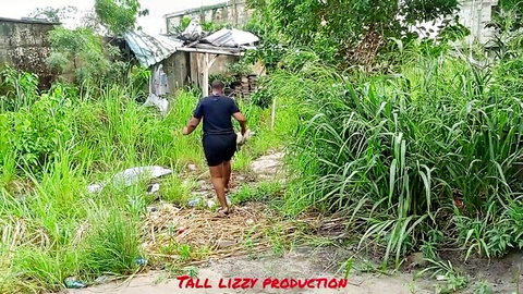 Nigerian man in shorts walking rural bush path, Tall Lizzy threesome preview