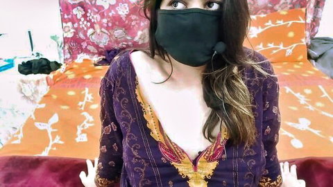 Sobia Nasir in low-cut purple dress showing natural cleavage