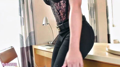 Estela Duarte in sheer black lace lingerie and tight pants, seductive side pose