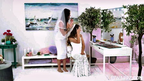 Madalina Moon and Juniper Ren in bridal dresses, teasing wedding prep