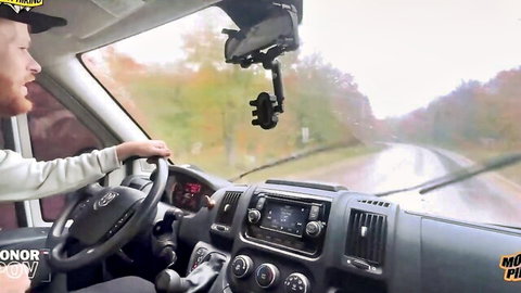 Conor driving van through rainy woods on wild night adventure