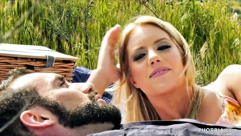 Candice Dare touches Jaxton Wheeler's face in outdoor threesome tease
