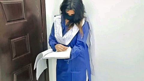 Desi Pakistani woman in blue salwar kameez and dupatta at door