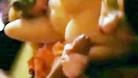 Close-up of thick veiny cock with cum dripping from tip held in hand