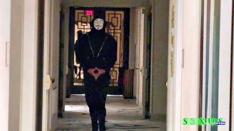 Aubrey Black in masked Coitus scene: anonymous figure in Guy Fawkes mask walks hallway