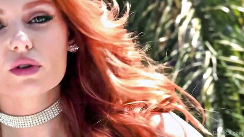 Lacy Lennon redhead close-up with sultry gaze and diamond choker