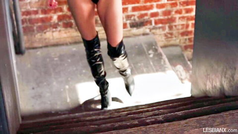 Anna Claire Clouds in shiny thigh-high boots showing bare ass in lesbian tease with Kenna James