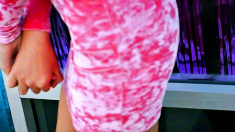 Hands pulling up petite girl's tight pink tie-dye dress teasing her small ass cheeks