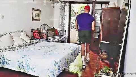Leo Felipo Latino stud in shorts walking in bedroom