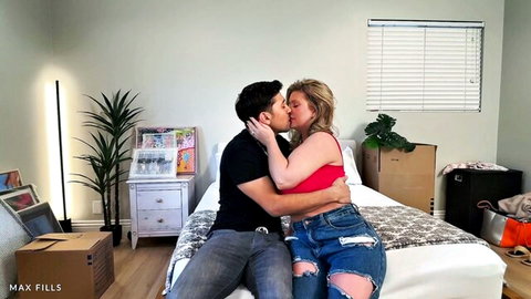 Andie Anderson passionately kissing neighbor on bed in ripped jeans