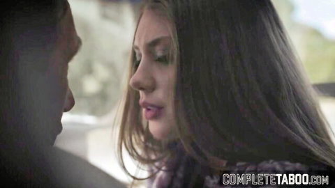 Elena Koshka in seductive close-up car scene with intense gaze and parted lips