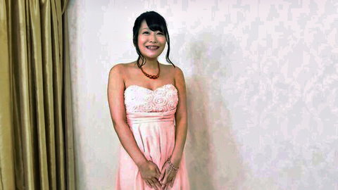 Misa Makise in elegant pink dress, smiling at luxury spa