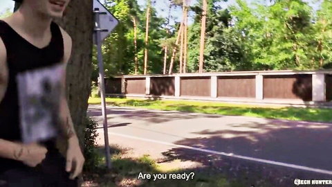 Muscular tattooed bear guy in tank top smiling outdoors ready for gay action