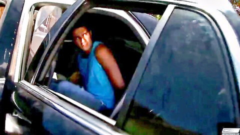 Ray Diaz in blue tank top leaning from car window, bisexual teaser with Vinny Castillo