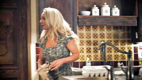 Curvy blonde MILF in short tight dress teasing big ass in kitchen