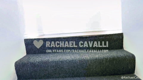Gray carpeted stairs with heavy Rachael Cavalli OnlyFans watermarks overlay