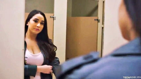 Karlee Grey in sexy bathroom mirror pose, cleavage in tight tank top
