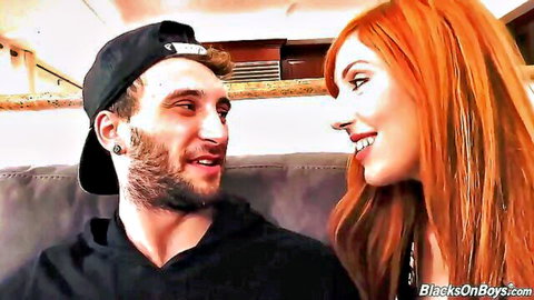 Bearded man in cap chats intimately with smiling redhead Ray Diese, Jesse Prather vibe