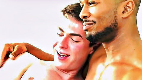 Muscular ebony hunk passionately embracing smiling shirtless white twink intimately