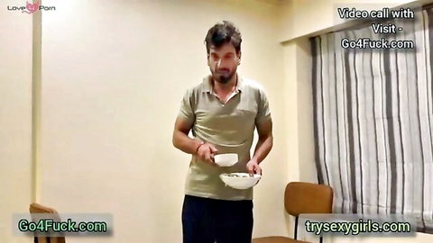 Indian man in polo shirt holding bowl during steamy hotel massage foreplay