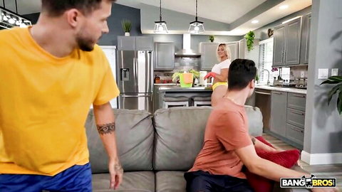 Busty blonde stepmom in teasing threesome pose with two guys, huge boobs