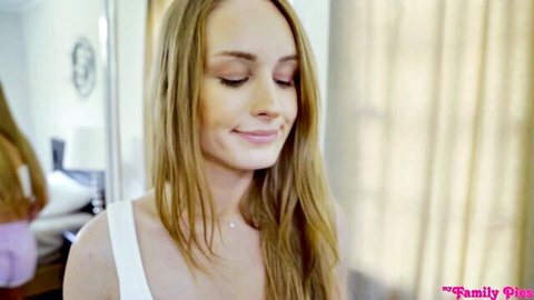 Blonde teen with medium tits smiling seductively in tight white tank top POV
