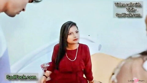 Indian woman in red dress on video call learning to please boyfriend
