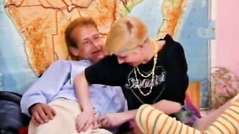 Annemarie B. slim blonde cuddles intimately with older redhead man