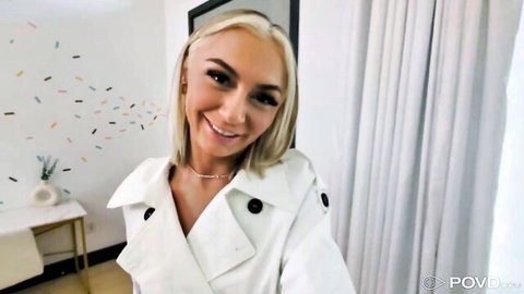 Chloe Temple teases in open white trench coat, smiling POV