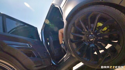 Sexy woman's leg out of black SUV door, teasing oral scene with muscular fan, Brazzers