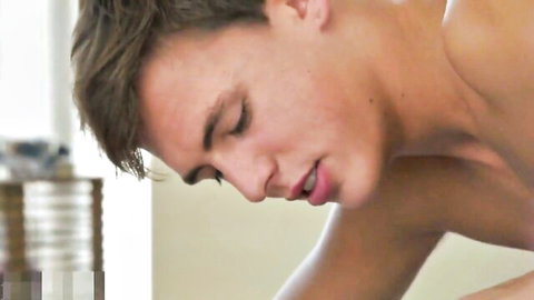 Close-up of horny European twink's face in passionate kiss
