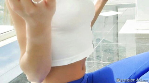 Petite brunette teen teasing toned abs in tight white sports bra and blue yoga leggings