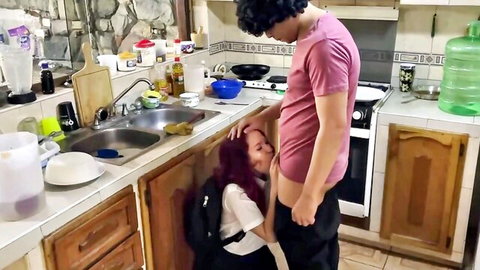 Redhead stepmom kneels before stepdad's hard cock in kinky oral scene