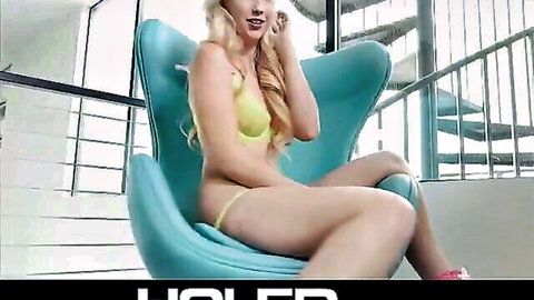 Blonde beauty in yellow bikini posing seductively