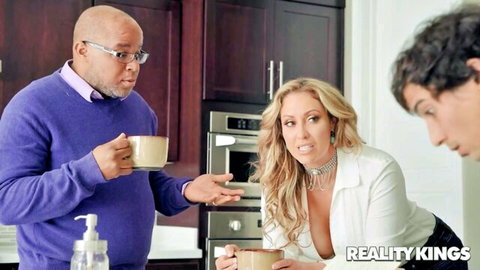Busty Eva Notty flirts in kitchen with hubby's roommate, deep cleavage tease