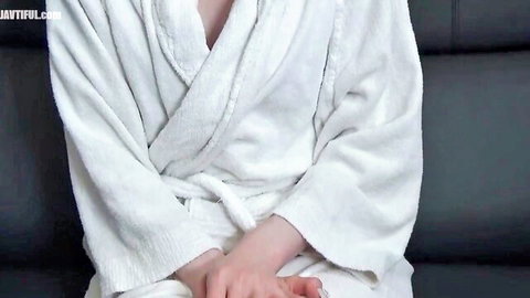 Slender fair-skinned beauty in open white bathrobe, petite tits hinted