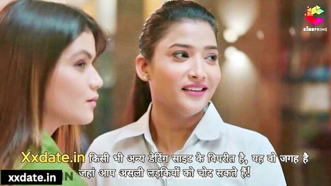 Two sexy Indian girls smiling seductively at each other in tight white shirts teasing big tits
