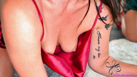 Whitney OC in red satin lingerie with deep cleavage and arm tattoos