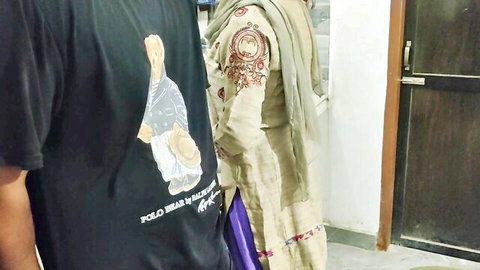 Punjabi Bhabhi in embroidered salwar kameez teases with lover at door