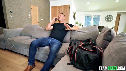 Man lounging on couch during phone call in Pixie Smalls' surprise scene