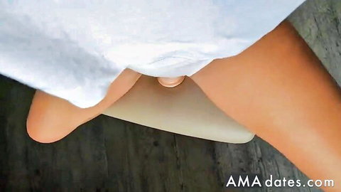 Horny teen masturbating with dildo on webcam, legs spread nude