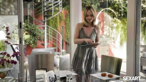 Lilly Bell in sexy gray dress holding plate, teasing food play