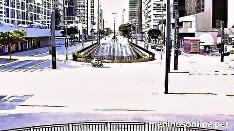 Empty Brazilian city avenue with central fountain, skyscrapers, palm trees and scooter parked