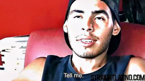 Sexy Latino hunk in tank top seductively says 'Tell me' on straightlatino.com