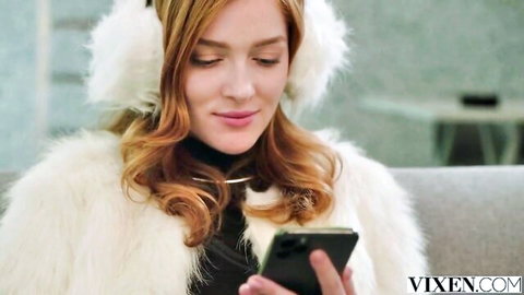 Jia Lissa in white fur earmuffs and coat, seductively checking phone