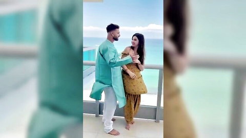 Meeti Kalher in intimate balcony embrace with partner in Indian attire