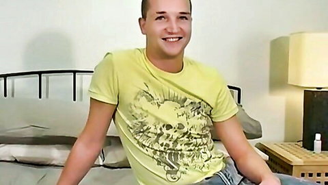 Young British man Mark smiling in yellow skull t-shirt, solo preview
